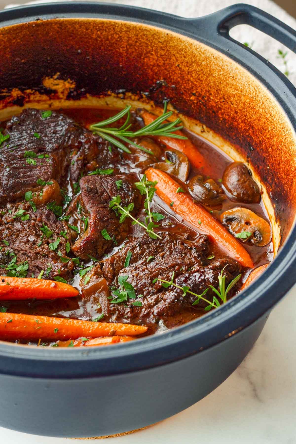 braised beef in dutch oven cooked with red wine