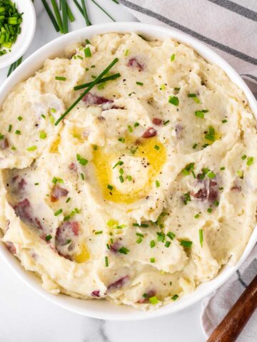 bowl of red mashed potatoes with chives