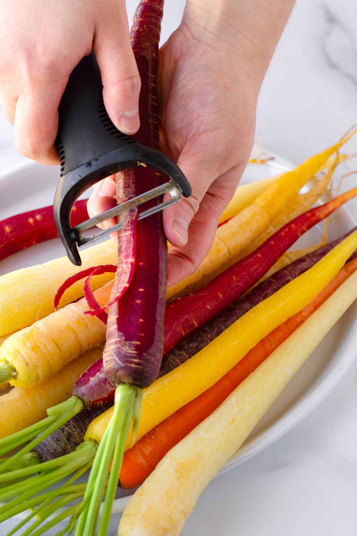 peeling carrots by hand