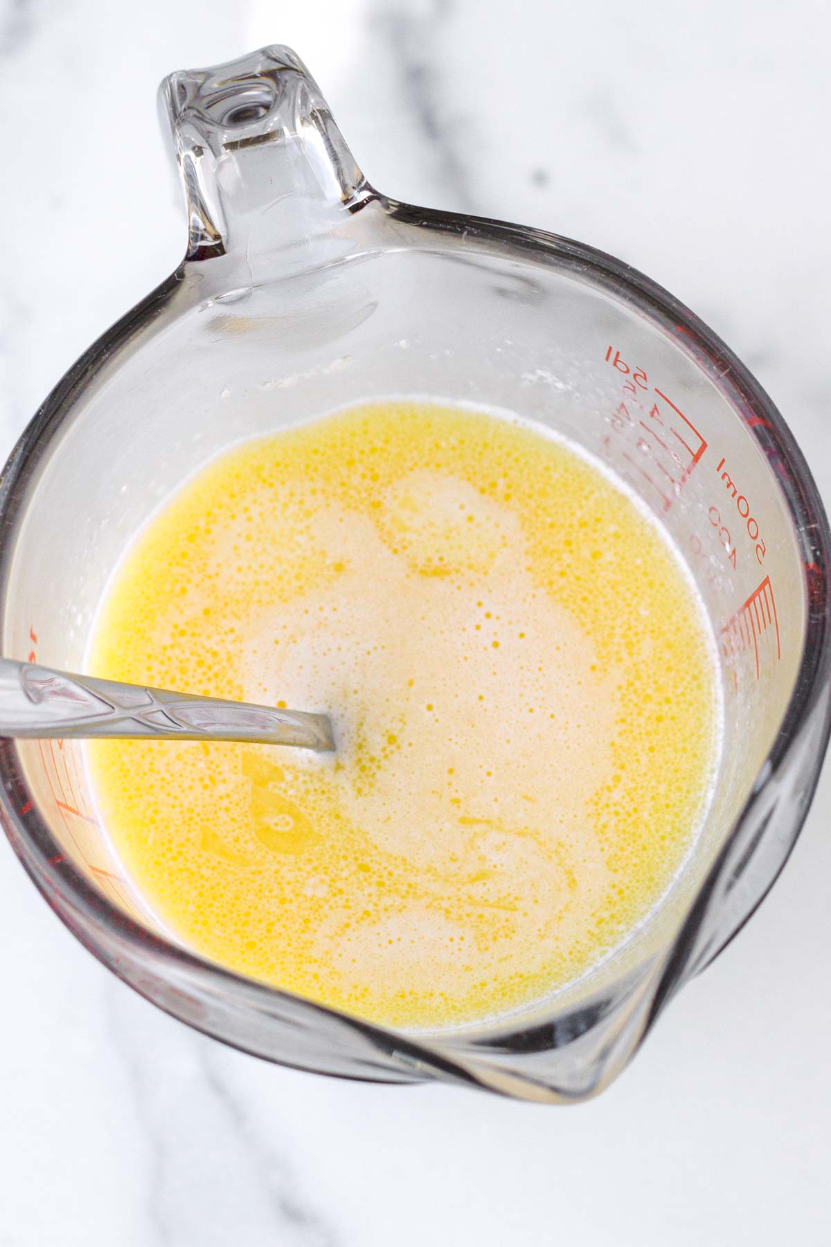 melted butter in measuring cup