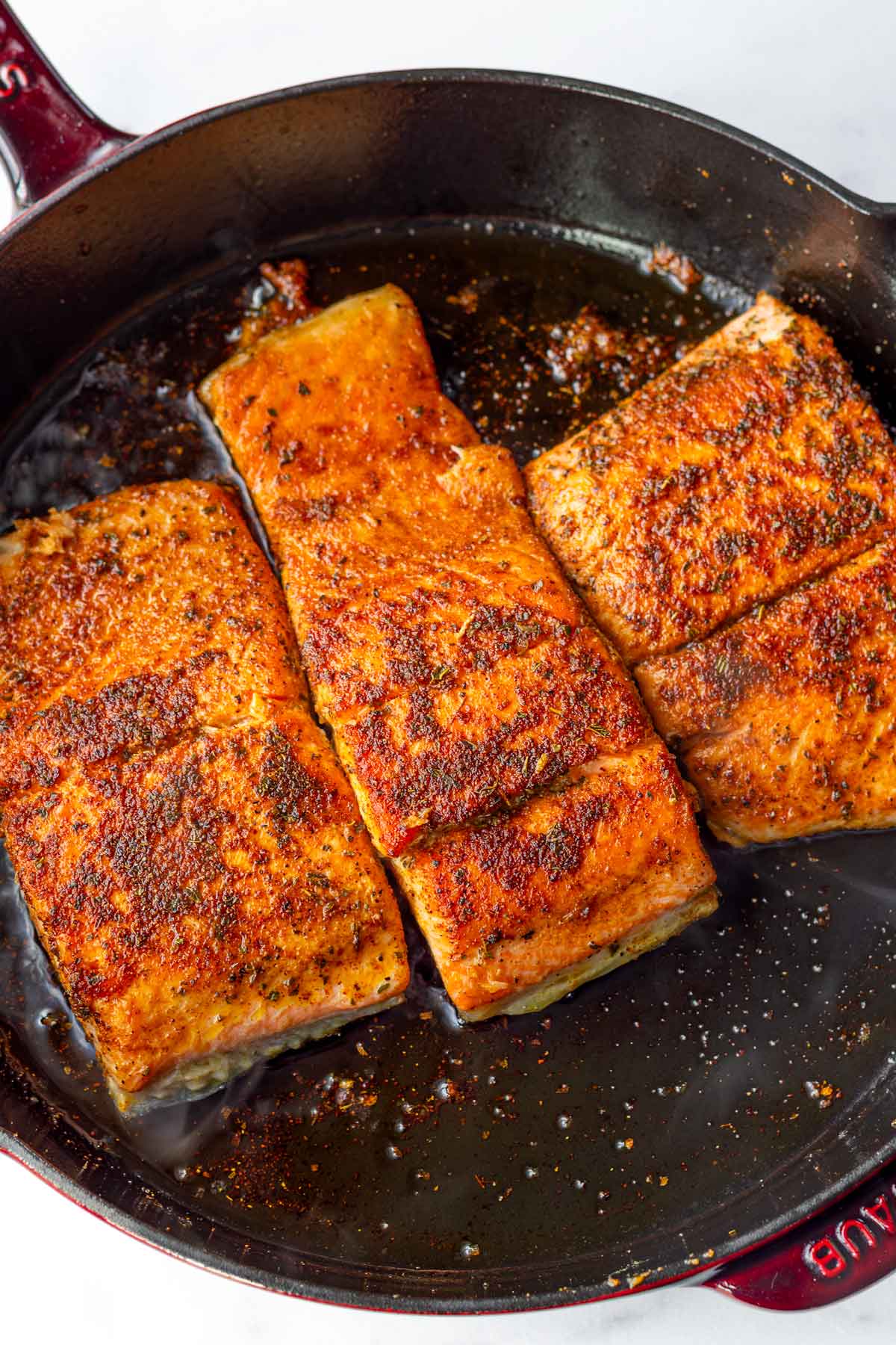 seared salmon in a cast iron pan