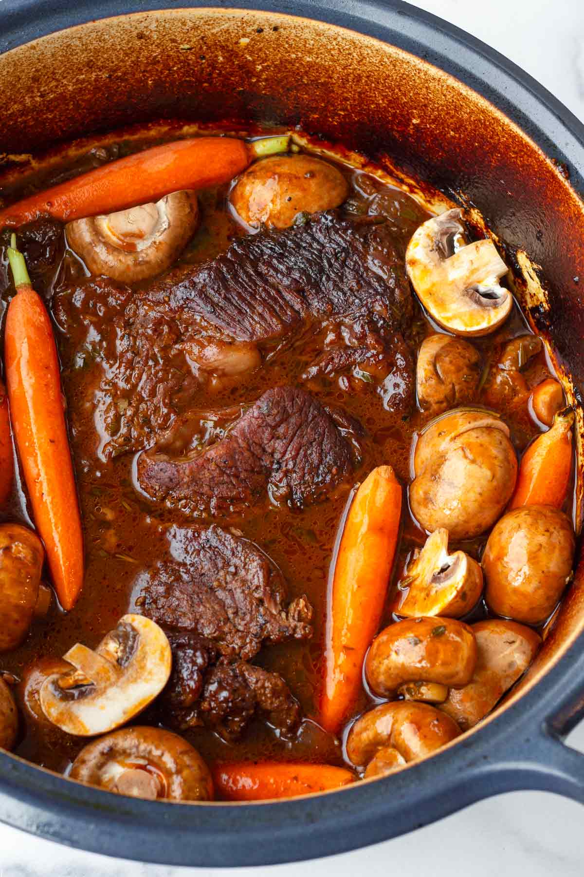 adding carrots and mushrooms