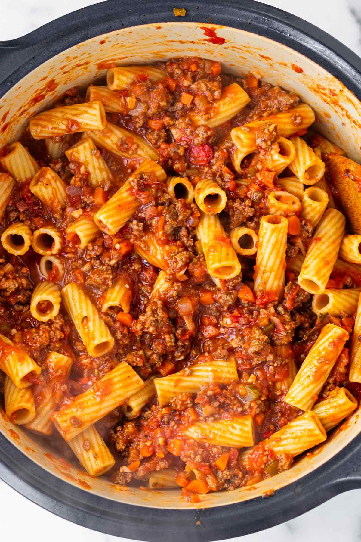 rigatoni pasta added to sauce
