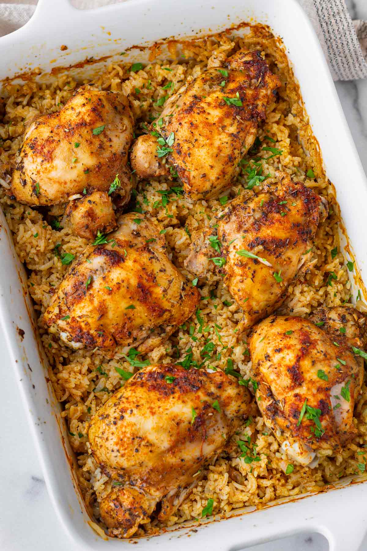 oven baked chicken and rice in a rectangular pan