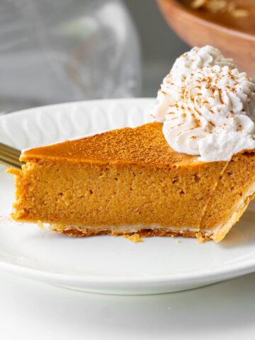 a slice of pumpkin pie made with heavy cream