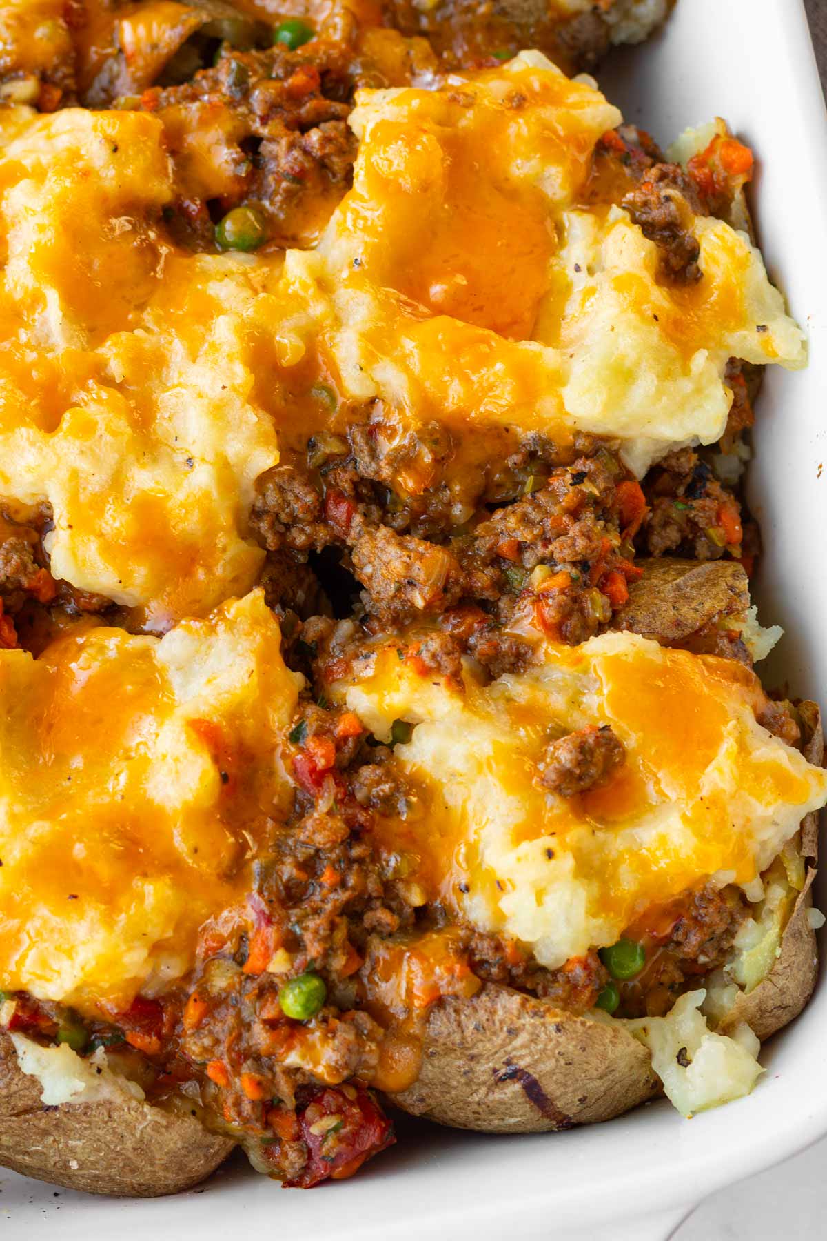 shepherds pie baked potatoes with cheese on top