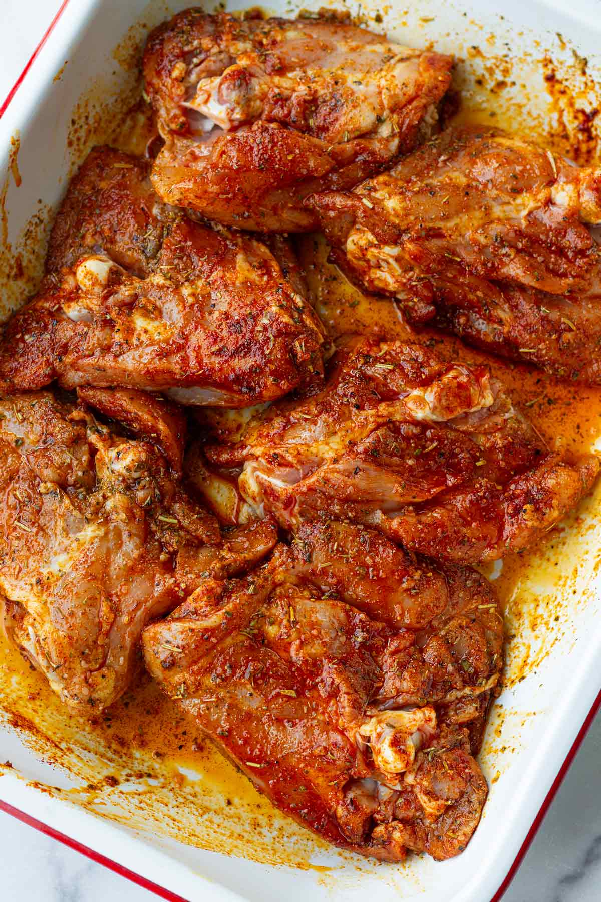 seasoned chicken thighs with spices and oil
