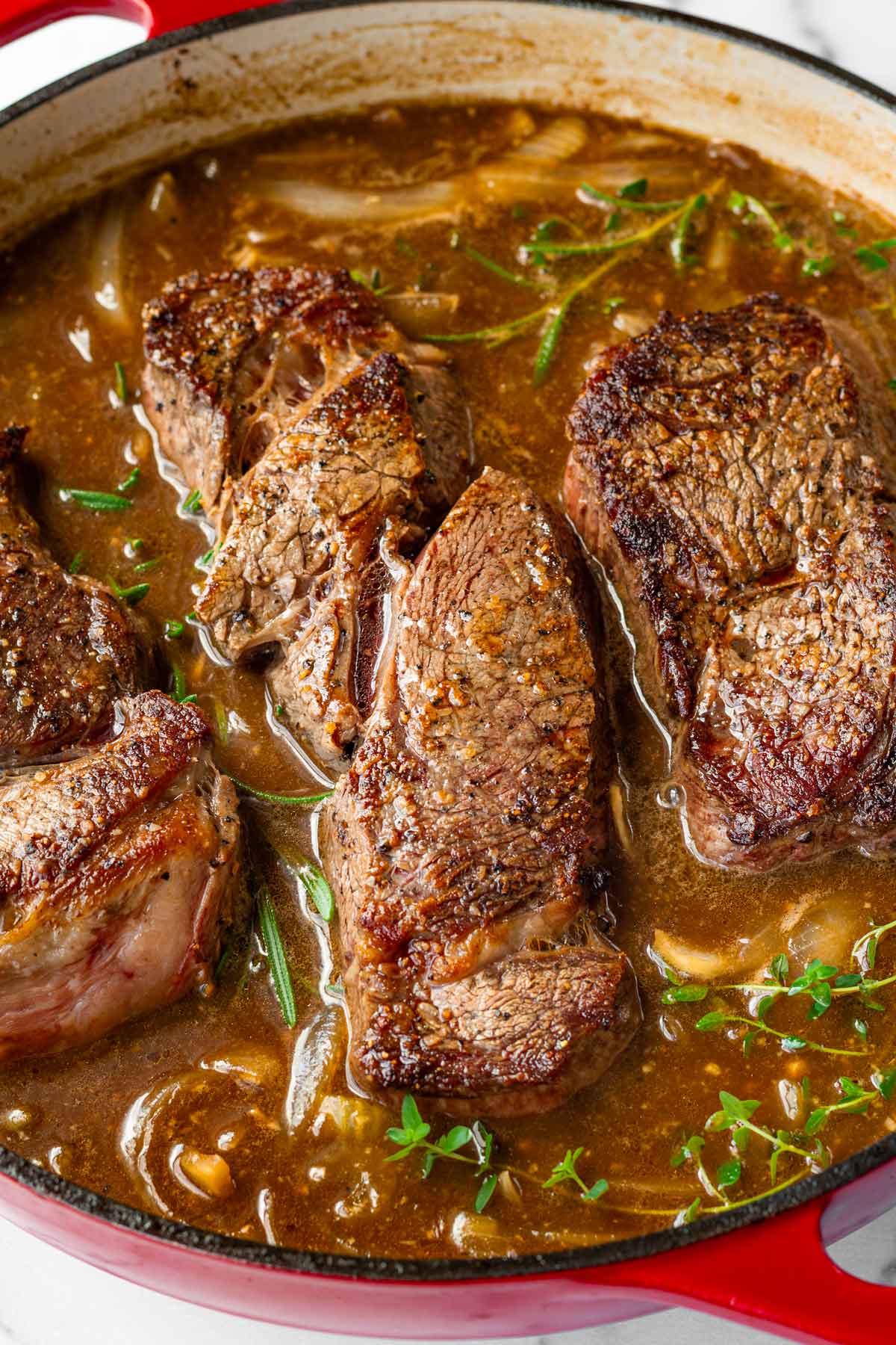 added broth and returned beef into braising pan