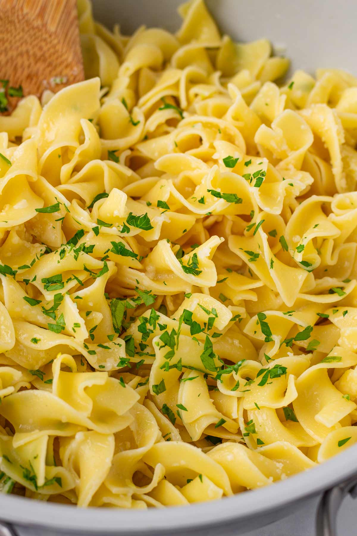 serving and garnishing buttered noodles