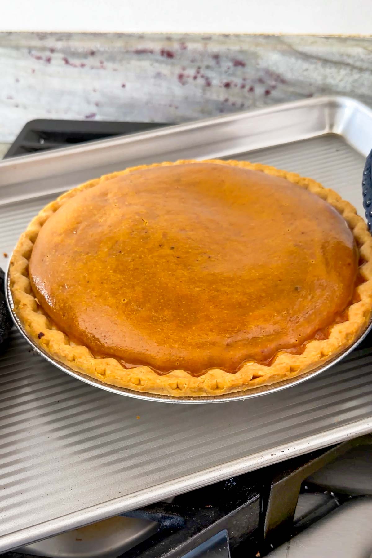 baked pumpkin pie puffed up straight out of the oven